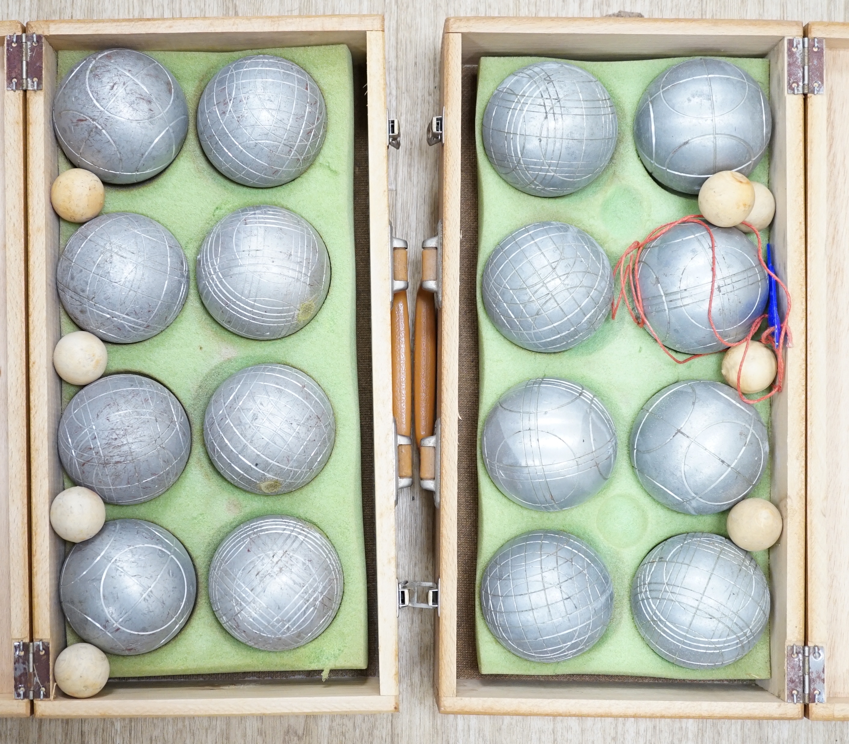 Two wooden-cased Petang sets
